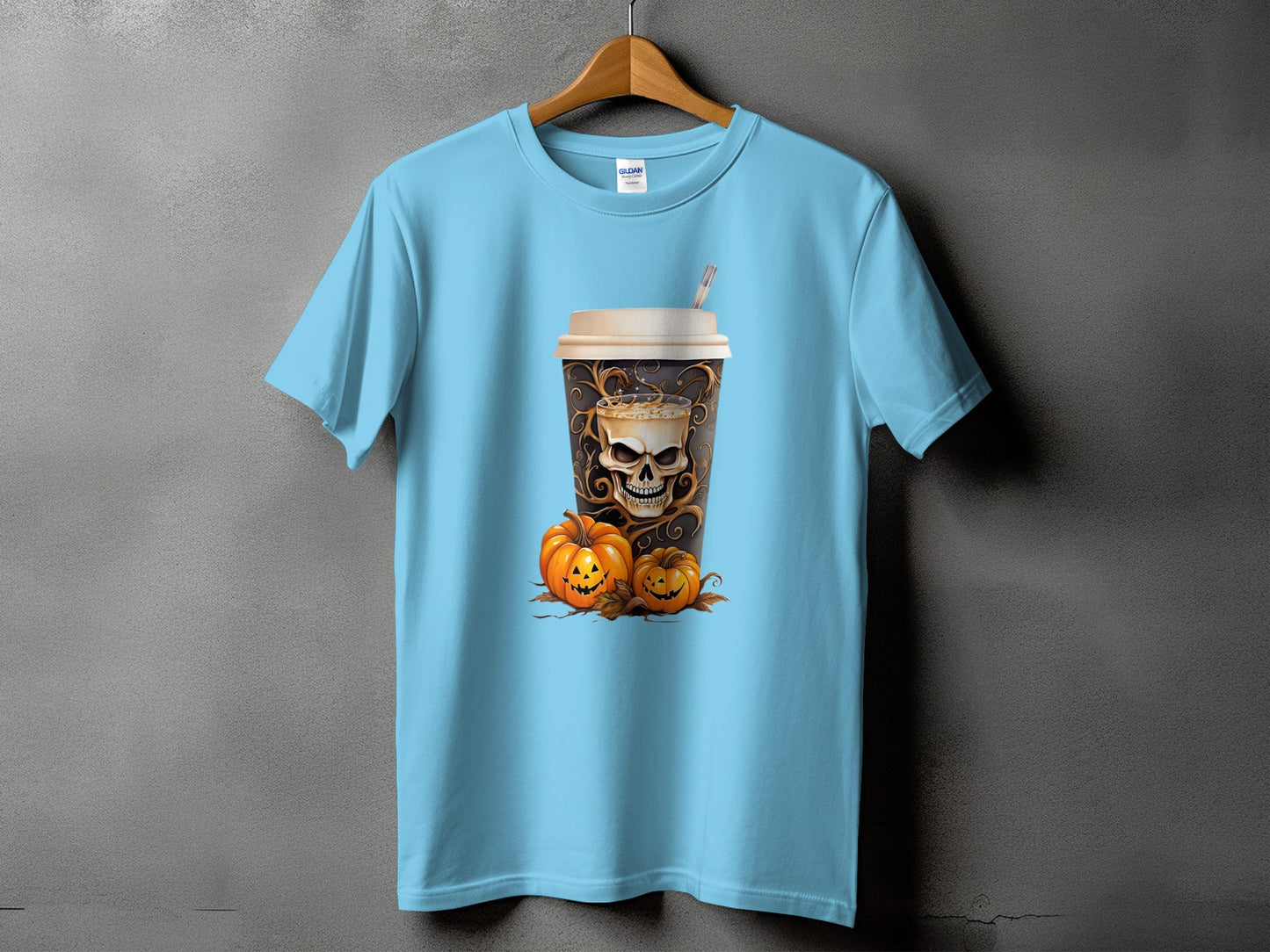 Light blue t-shirt with a coffee cup featuring a skull and two pumpkins.