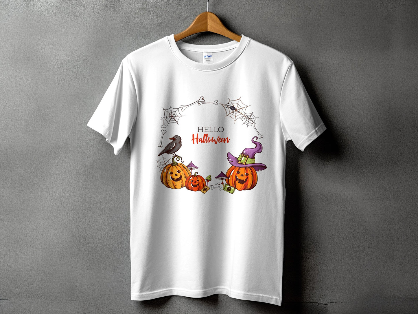 White t-shirt with "HELLO Halloween" text and pumpkins, crow, and witch hat graphic.