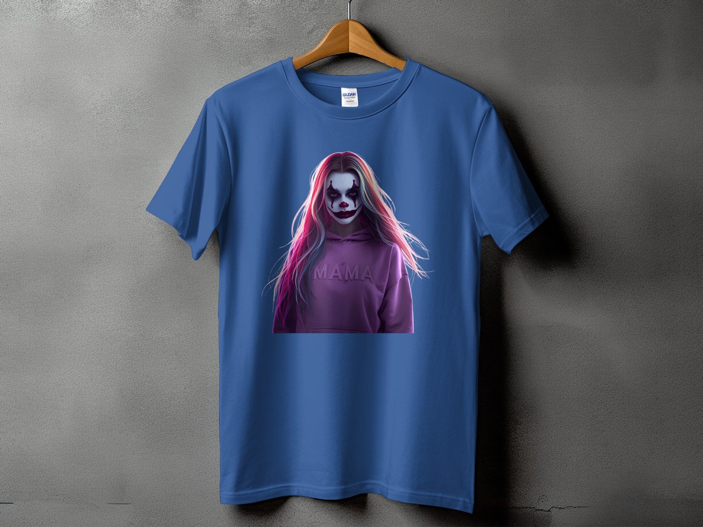 Blue t-shirt with a graphic of a woman with clown makeup and pink hair saying "MAMA".