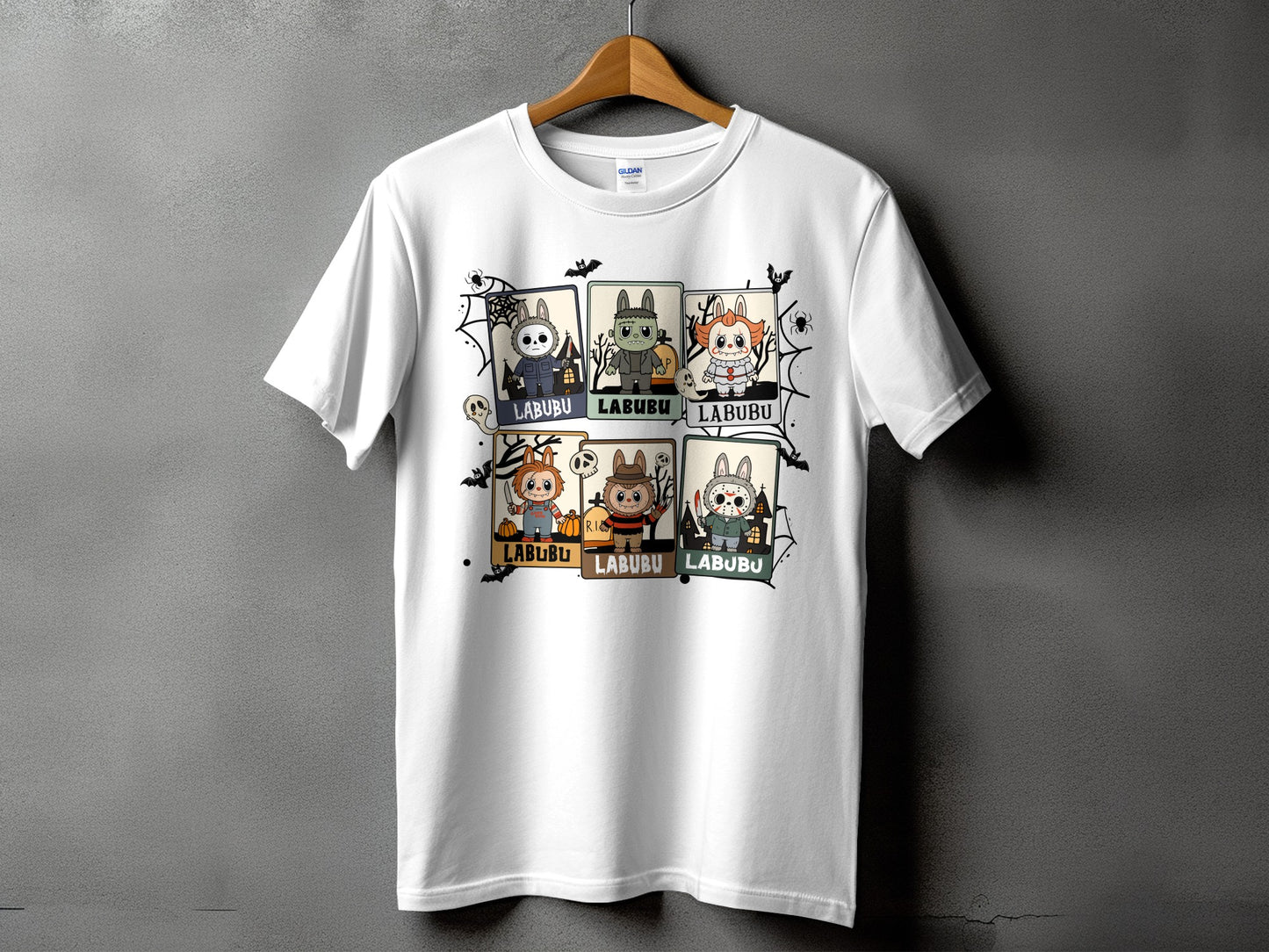White t-shirt with a collage of six cartoon Halloween characters with the word "LABUBU".