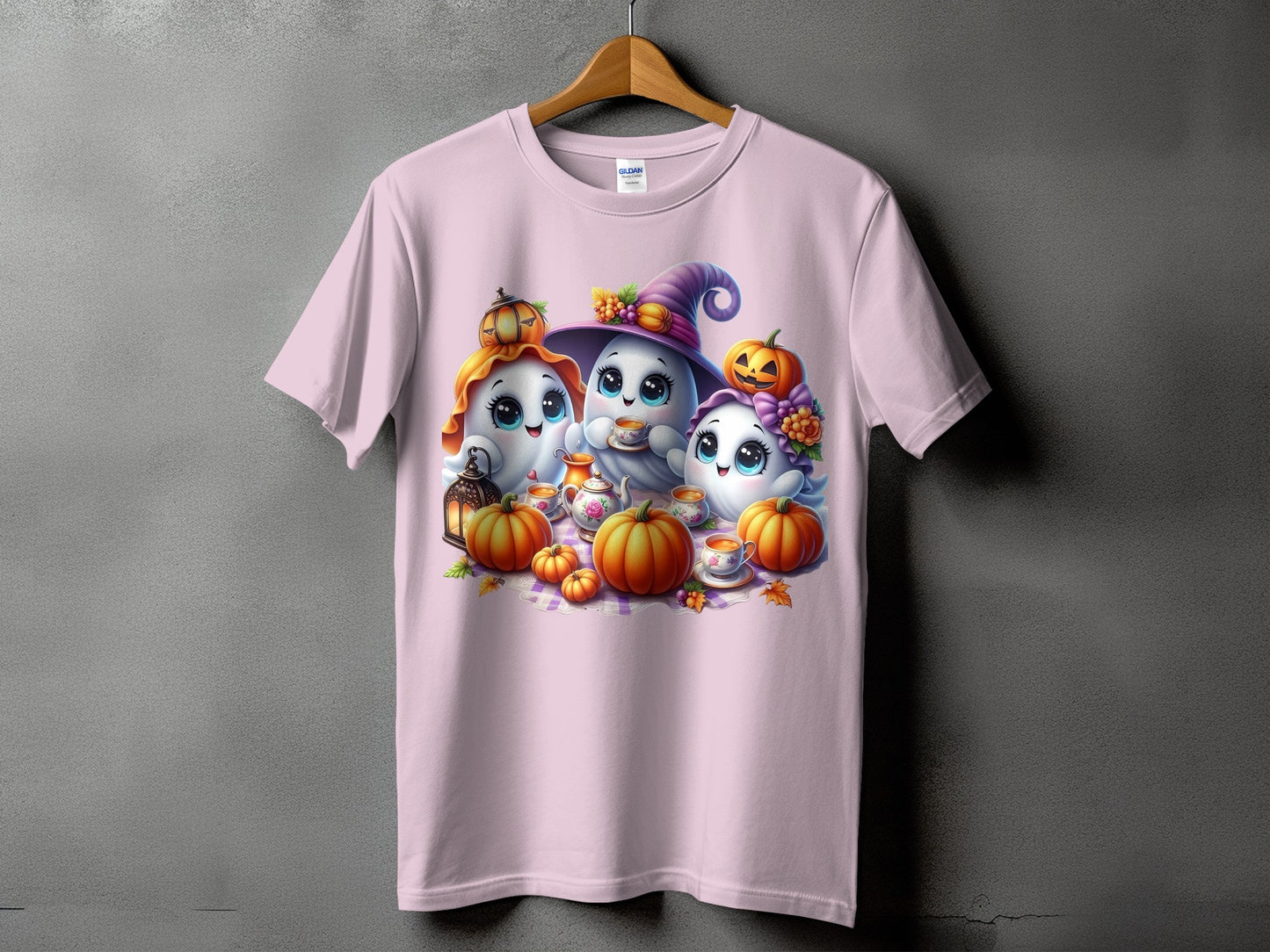 Pink t-shirt with three cute ghosts, pumpkins, and tea set graphic.