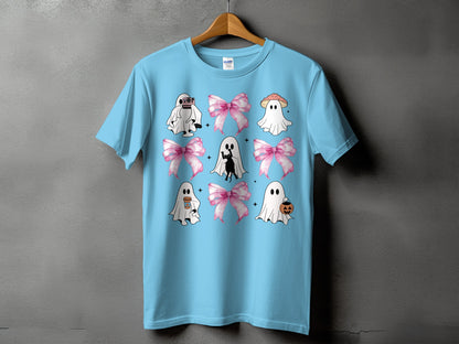 Light blue t-shirt with a repeating pattern of cute ghosts, pink bows, and Halloween elements.