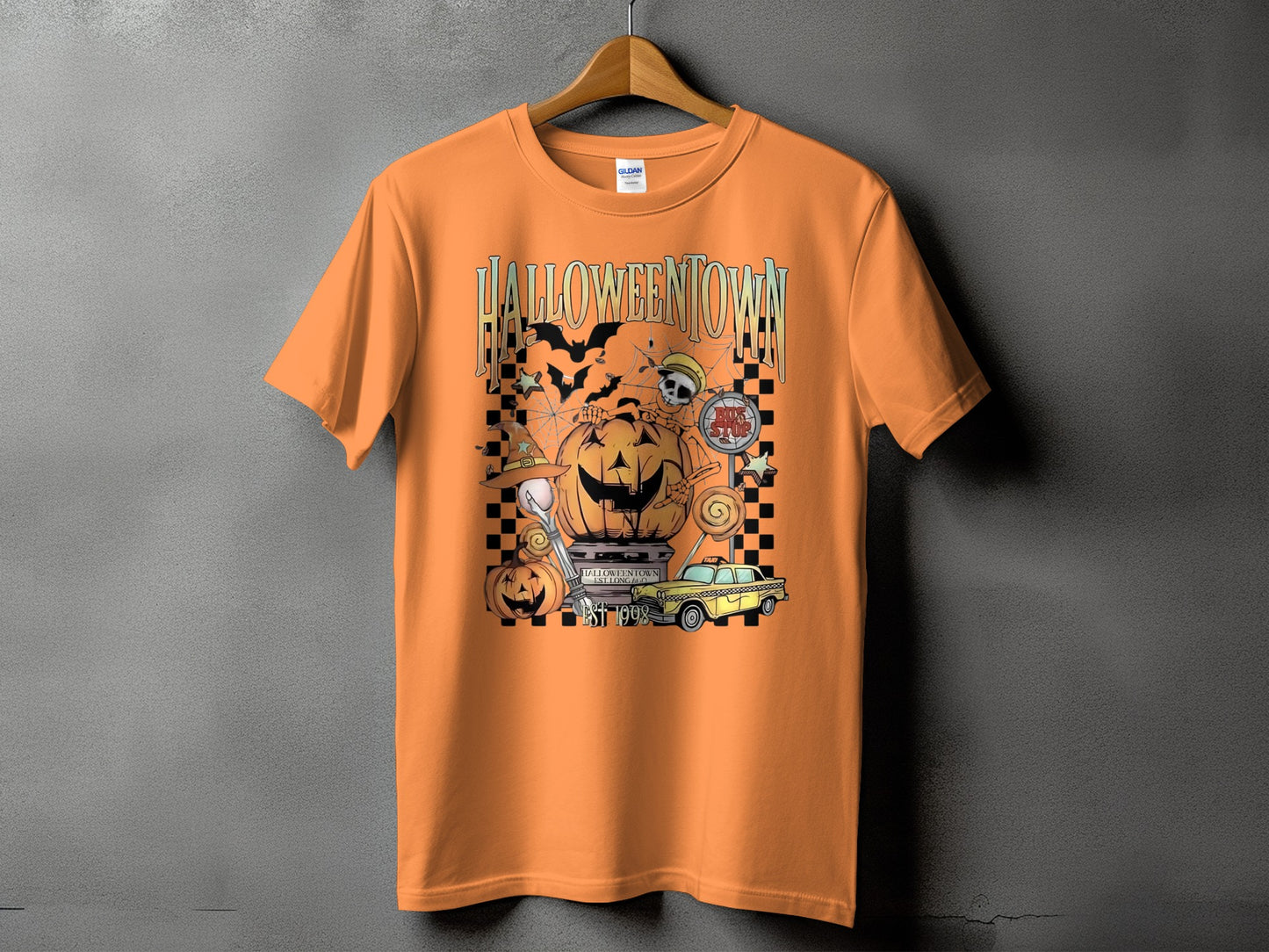 Orange t-shirt with "HALLOWEENTOWN EST. 1998" graphic featuring pumpkins, bats, and a yellow taxi.