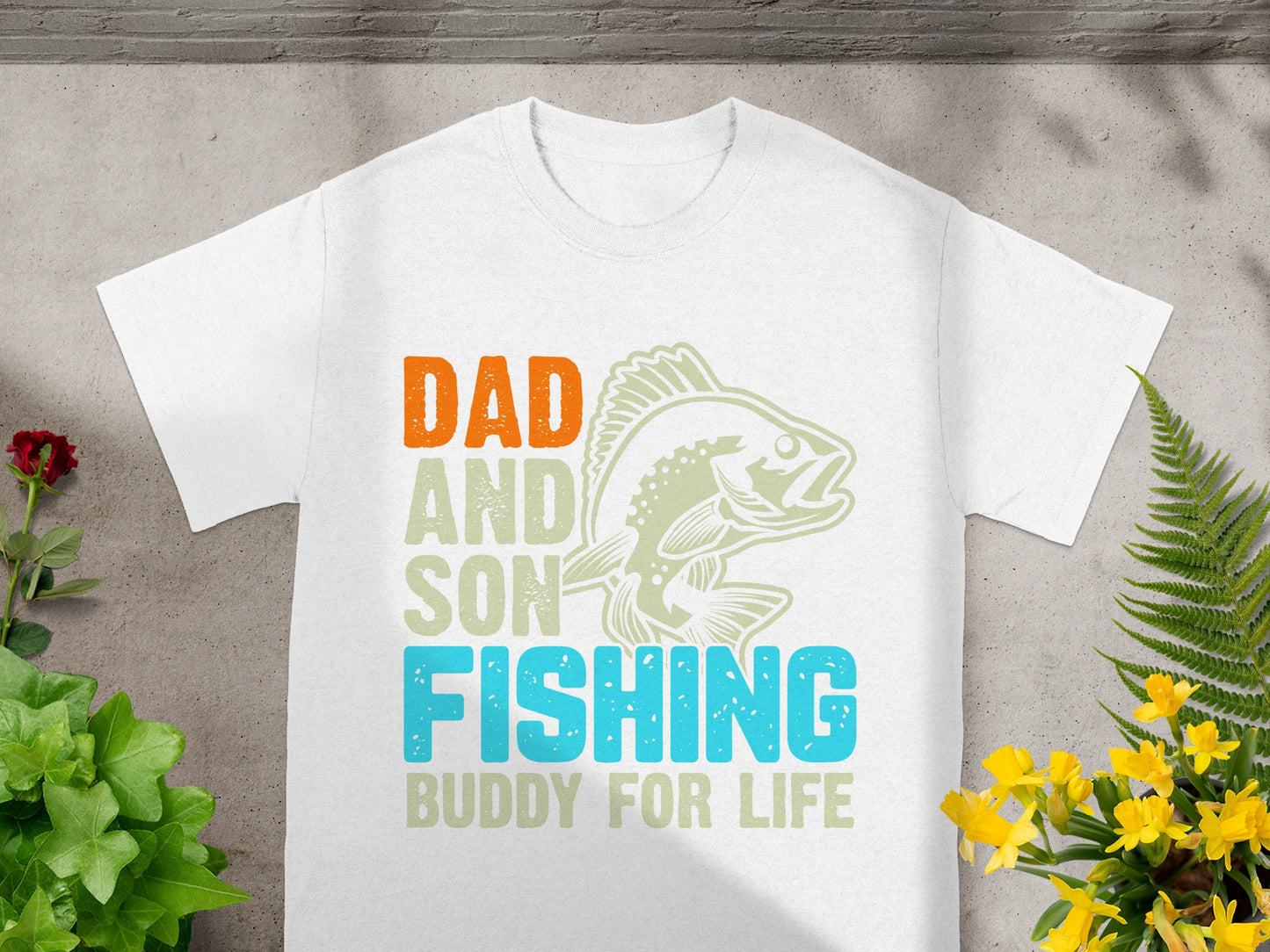 White t-shirt with "Dad and Son Fishing Buddy For Life" text and fish graphic.