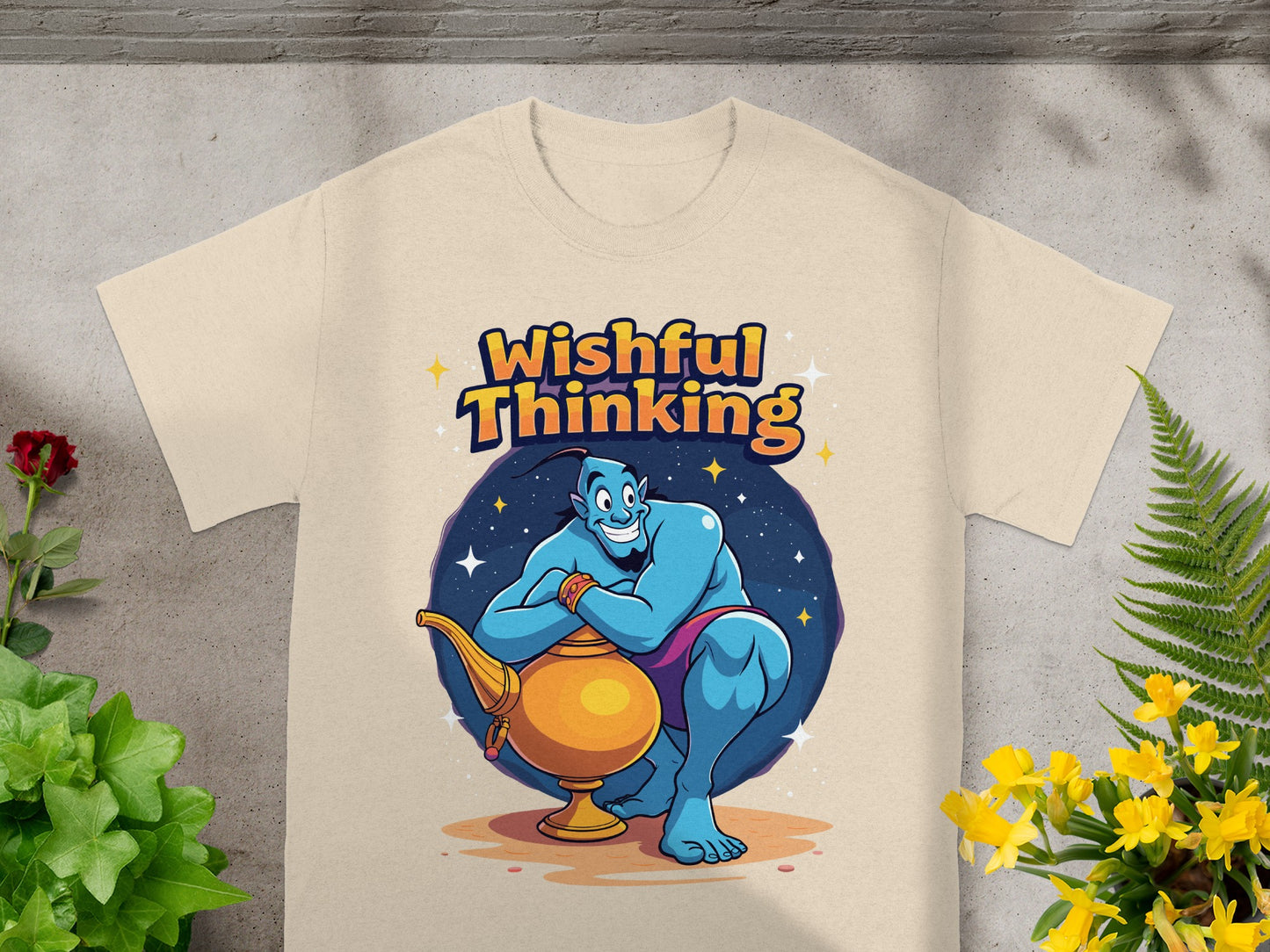 Genie from Aladdin sitting with a lamp, wearing a tan t-shirt with "Wishful Thinking" text.