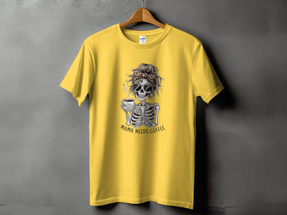 Yellow t-shirt with skeleton graphic and text "MAMA NEEDS COFFEE".