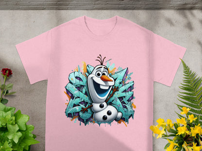Pink t-shirt with Olaf from Frozen standing in front of teal graffiti art.