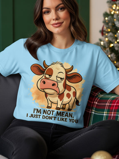 Light blue t-shirt with a cartoon cow and the text "I'M NOT MEAN, I JUST DON'T LIKE YOU".