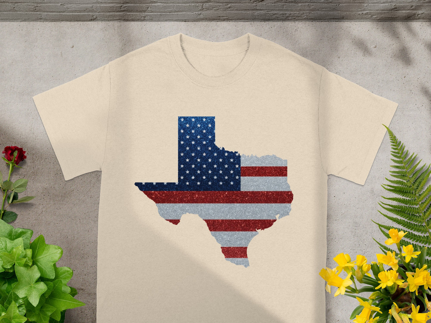 T-shirt with Texas outline filled with distressed American flag pattern.
