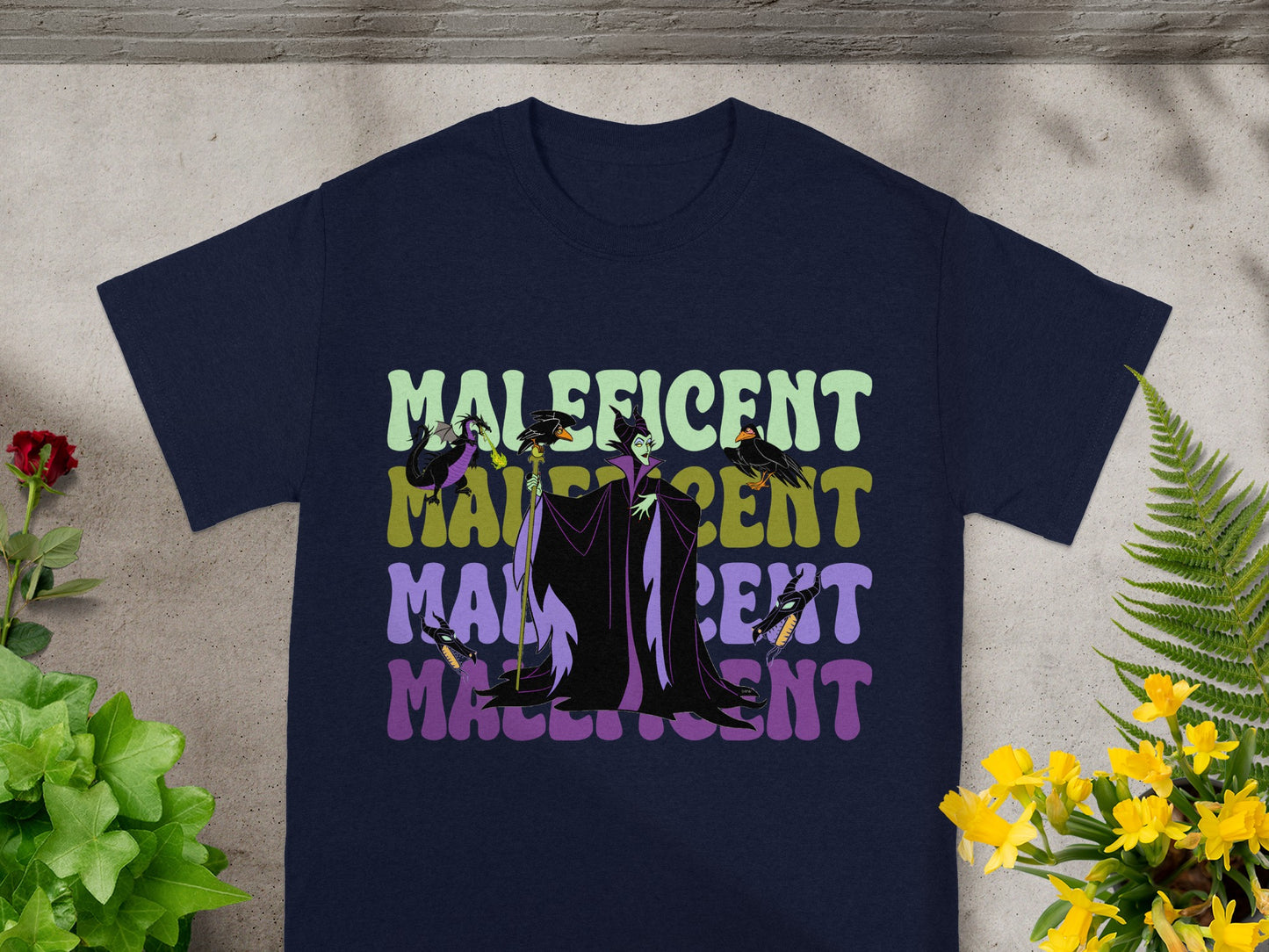 Maleficent graphic on a dark t-shirt, with repeating text.