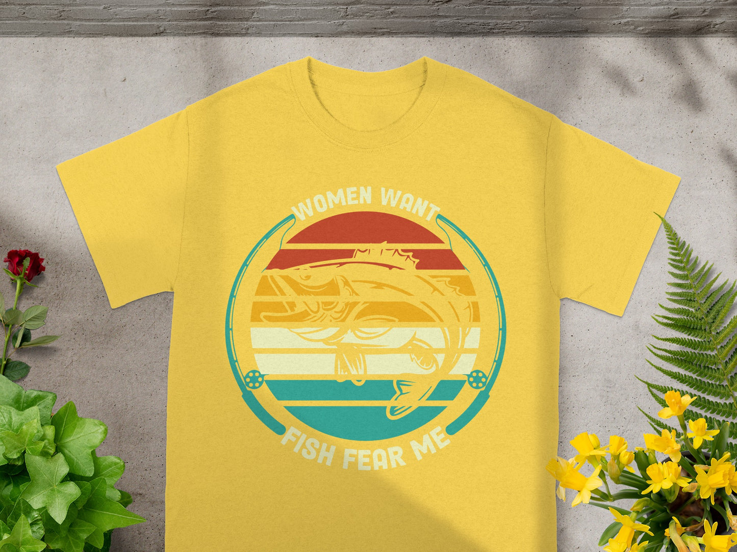 Yellow t-shirt with "Women Want" and "Fish Fear Me" text and a bass fish.