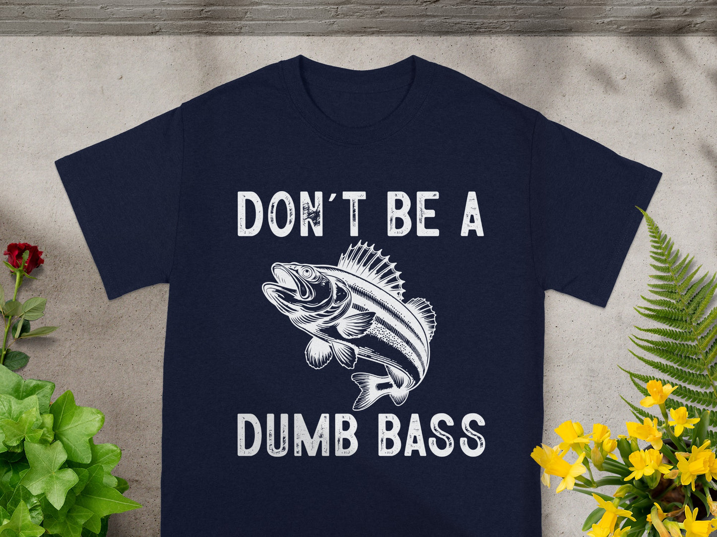 Navy t-shirt with "DON'T BE A DUMB BASS" text and fish graphic.