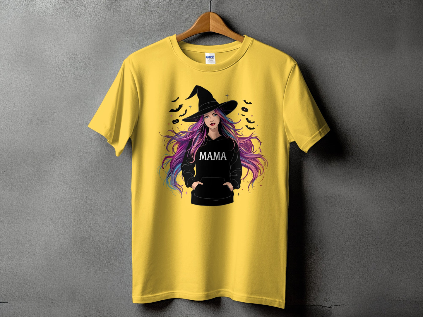 Yellow t-shirt with witch graphic and "MAMA" text, surrounded by bats.