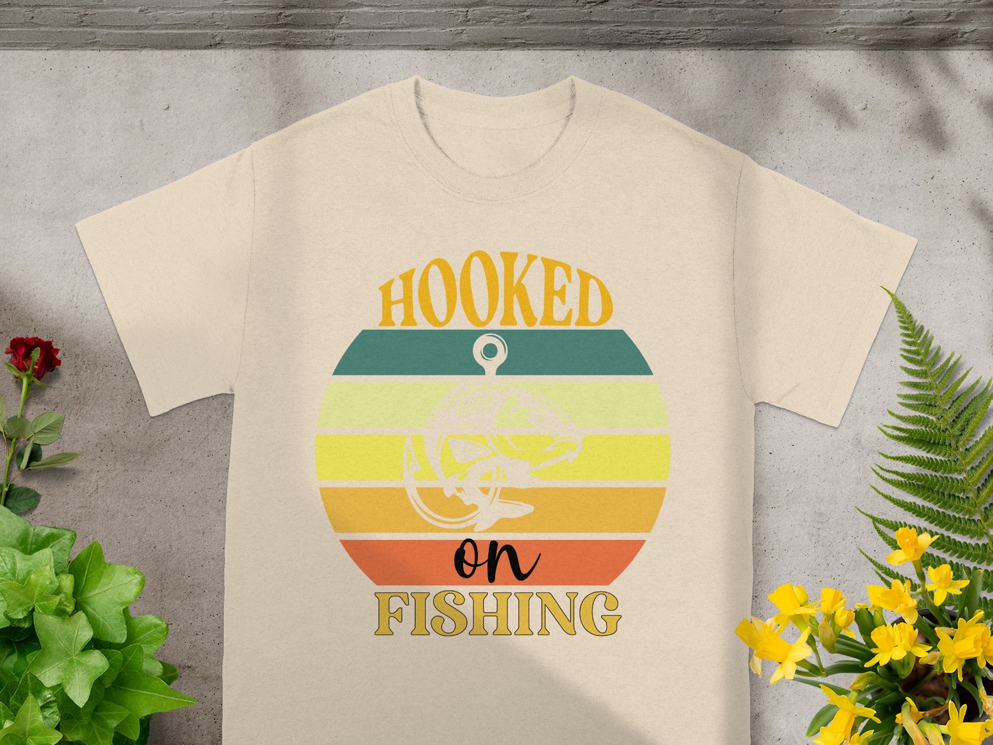 T-shirt with "Hooked on Fishing" text and a leaping fish graphic.