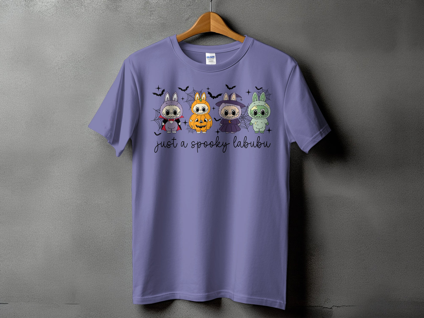 Lavender t-shirt with four spooky Labubu characters and "just a spooky labubu" text.