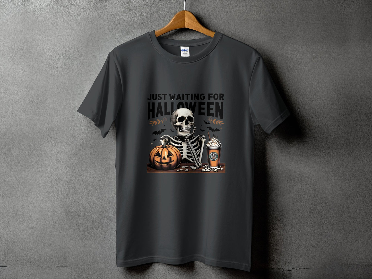 Dark gray t-shirt with skeleton, pumpkin, and coffee cup graphic.
