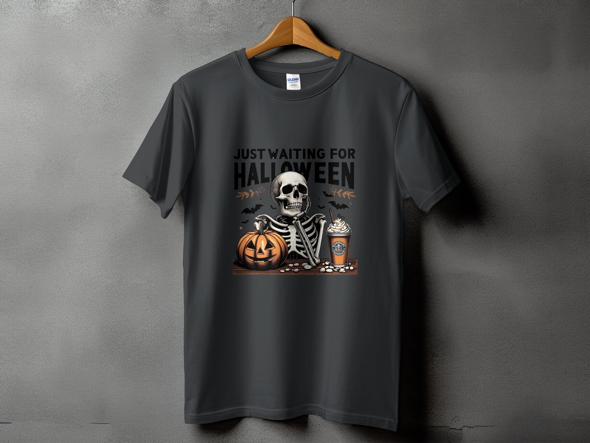 Dark gray t-shirt with skeleton, pumpkin, and coffee cup graphic.