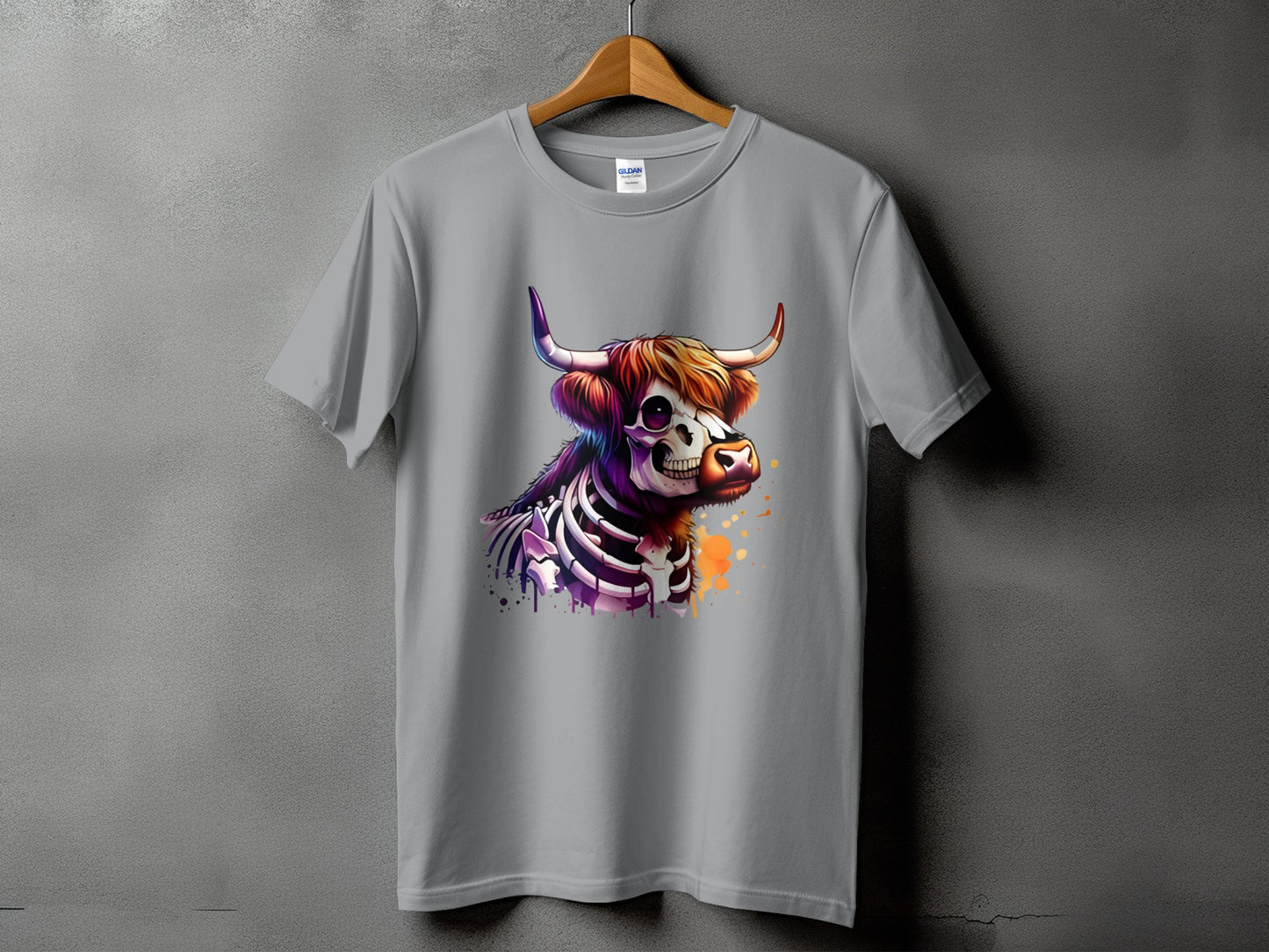 Gray t-shirt with a colorful, skeleton-themed Highland cow graphic.