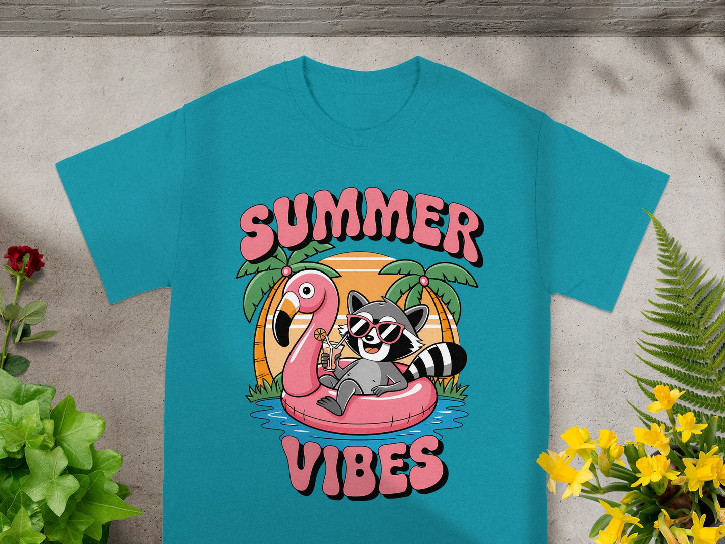Raccoon with sunglasses on flamingo float, "SUMMER VIBES" text on teal shirt.