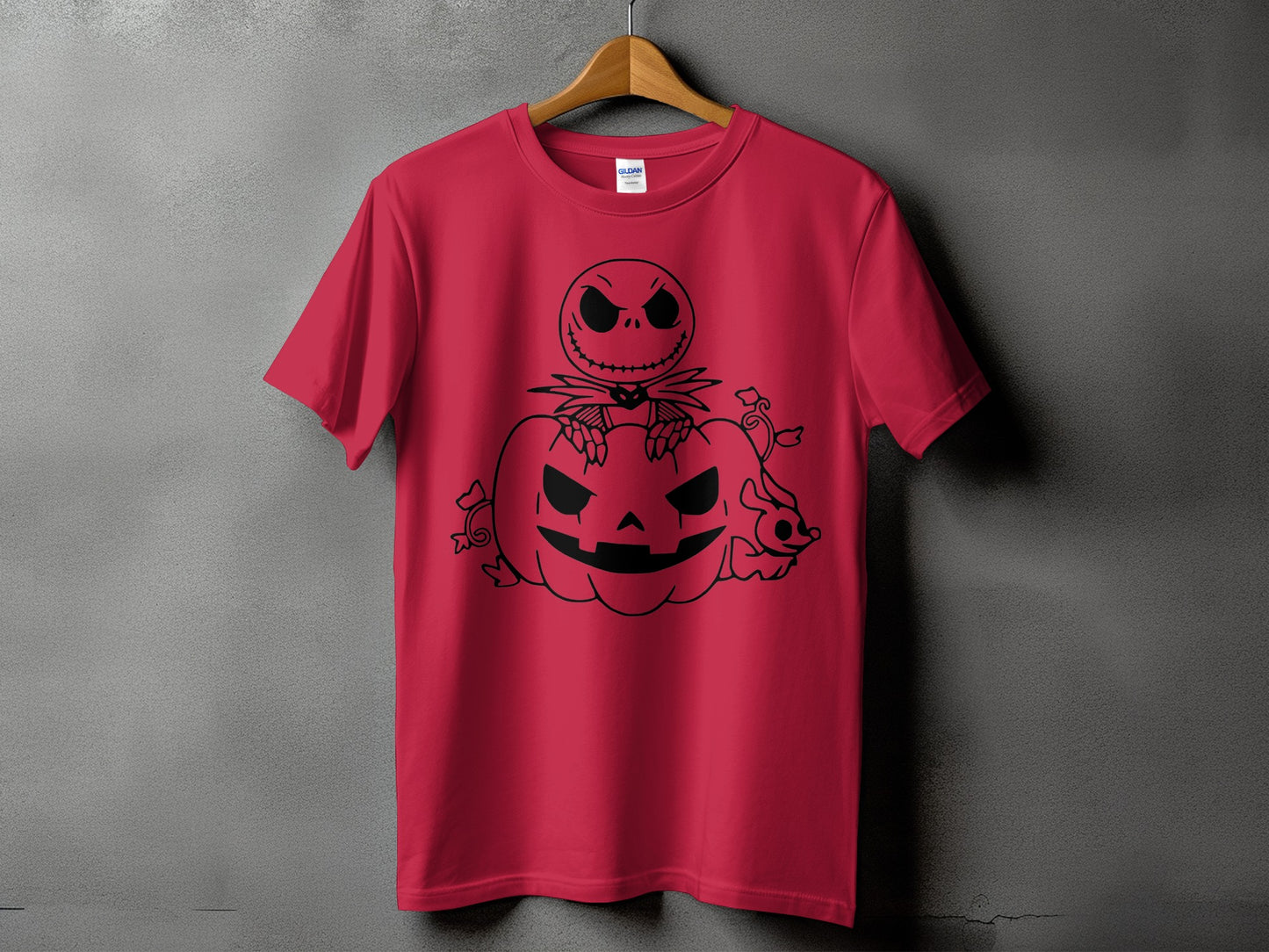 Jack Skellington sitting on a carved pumpkin on a red t-shirt.