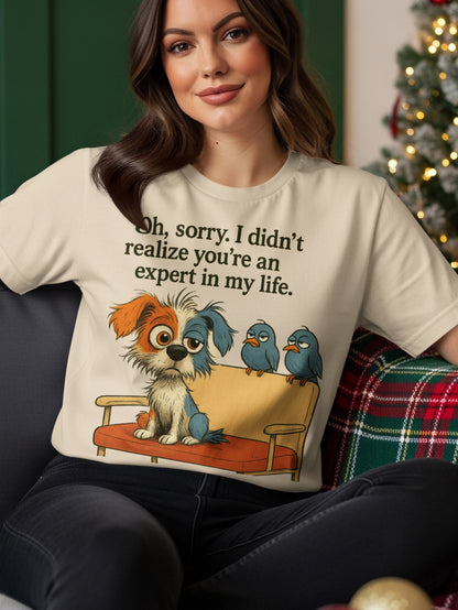 T-shirt with a dog and birds on a couch, reads "Oh, sorry. I didn't realize you're an expert in my life."