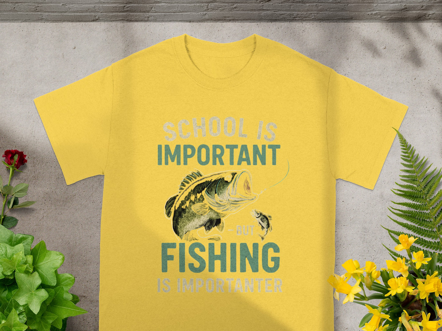 Yellow t-shirt with text "SCHOOL IS IMPORTANT BUT FISHING IS IMPORTANTER" and a bass fishing graphic.