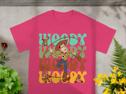 Pink t-shirt with cartoon Woody and Toy Story characters on it.