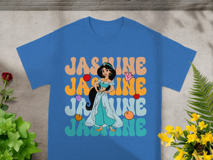 Blue t-shirt with "Jasmine" in colorful, retro lettering and character illustration.