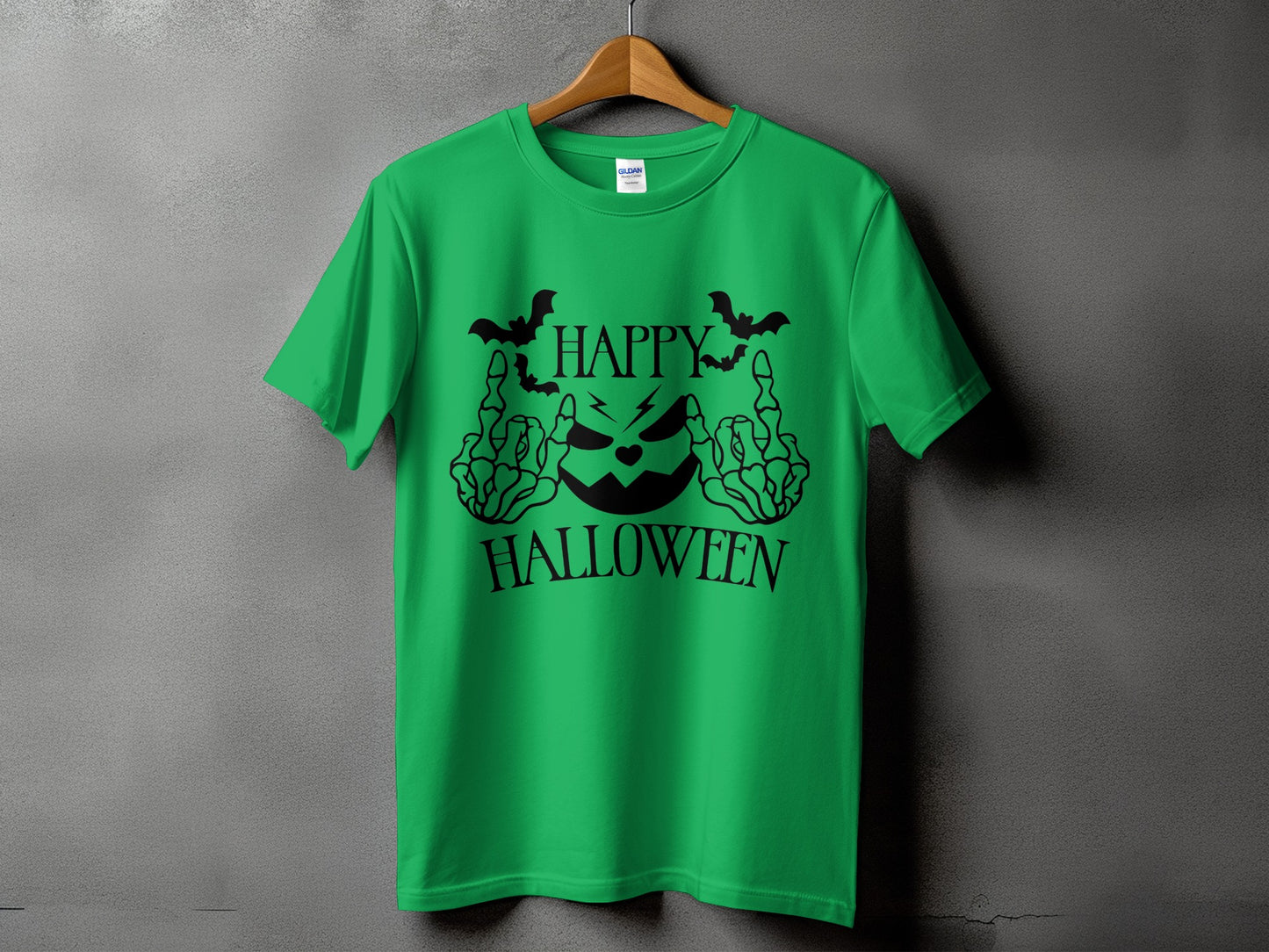Green t-shirt with black Halloween graphic featuring a jack-o'-lantern and text.