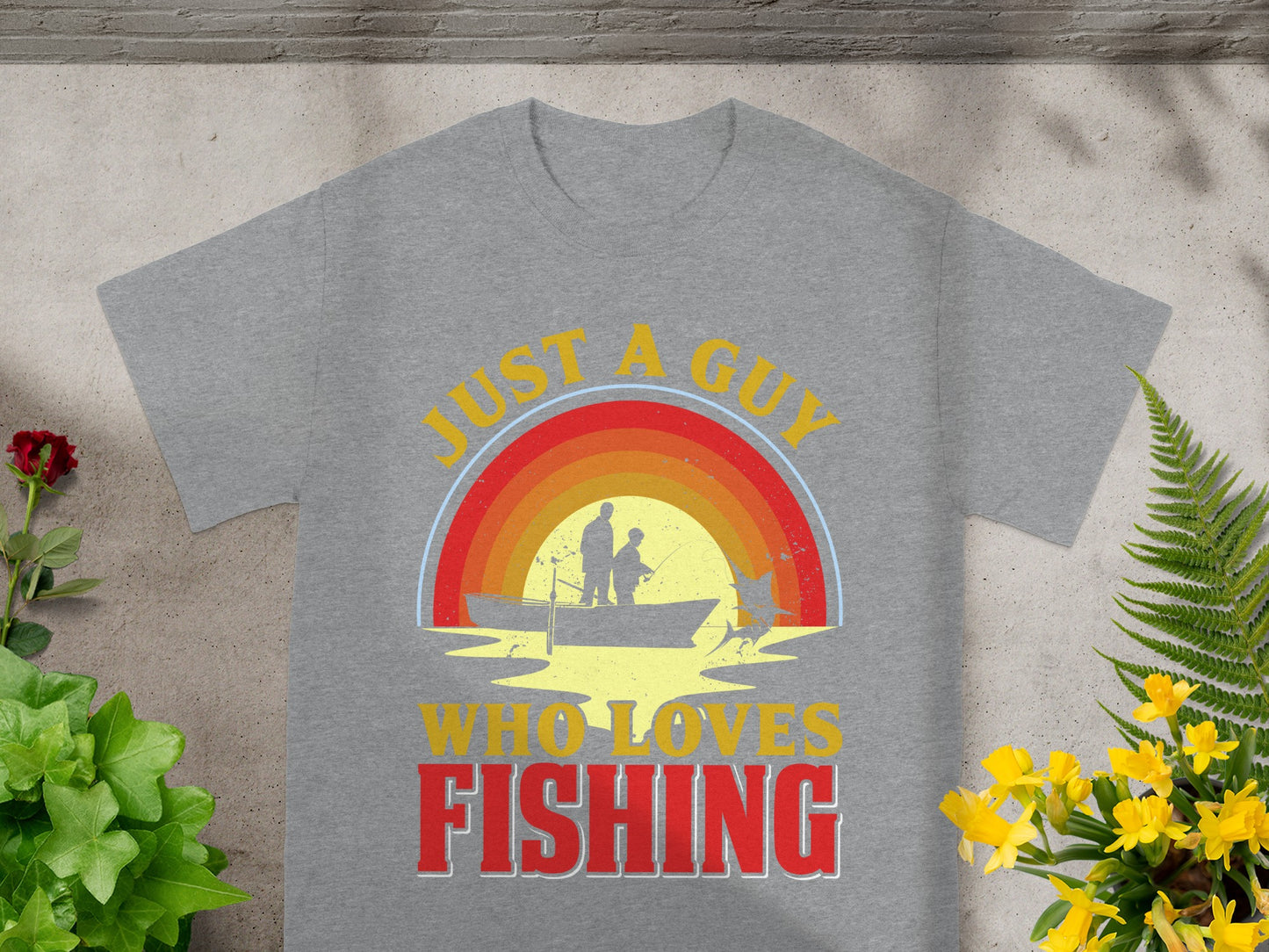 Grey t-shirt with "Just a guy who loves fishing" text and fishing boat graphic.