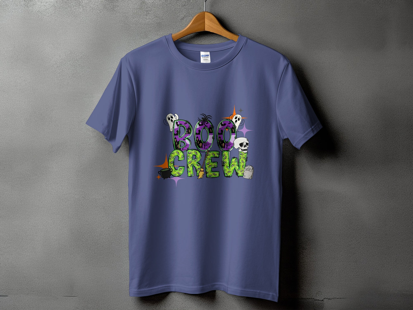 Purple t-shirt with "Boo Crew" Halloween graphic featuring ghosts, skulls, and bats.