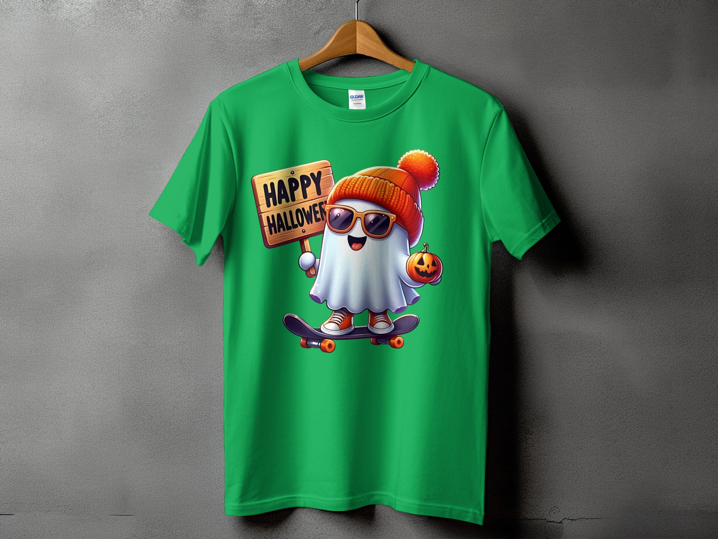 Green t-shirt with cartoon ghost on skateboard holding "Happy Halloween" sign and pumpkin.