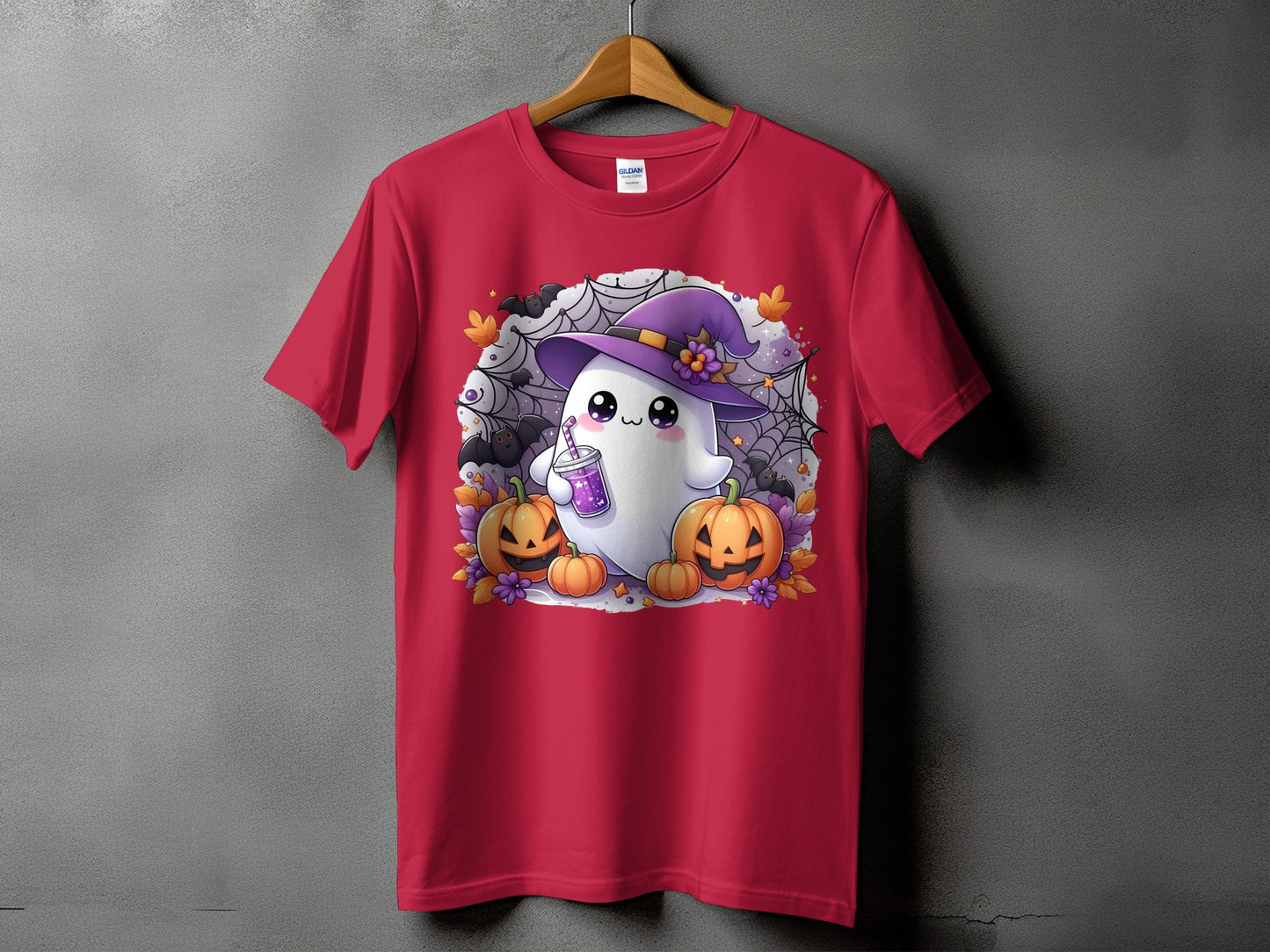 Red t-shirt with a cute ghost wearing a witch hat, holding a drink, surrounded by pumpkins and bats.
