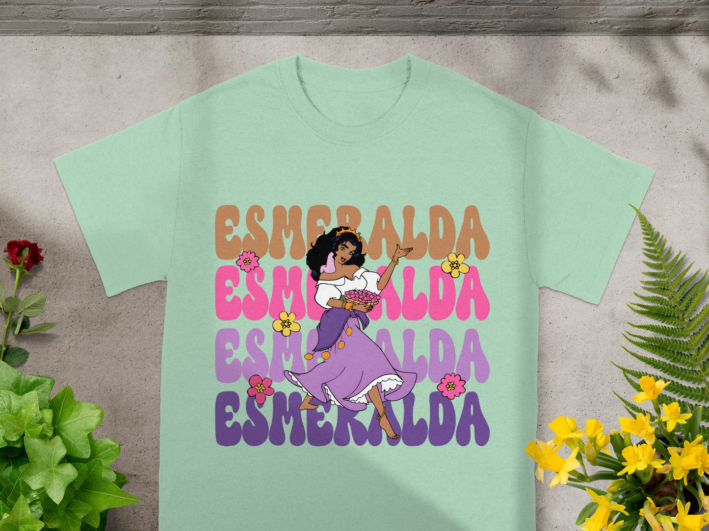 Esmeralda character dancing in purple dress, "Esmeralda" text.