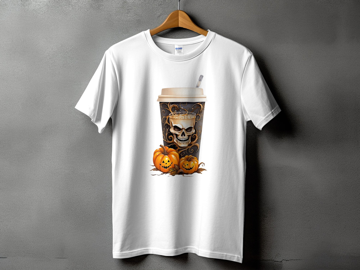 White t-shirt with a Halloween coffee cup design featuring a skull and pumpkins.