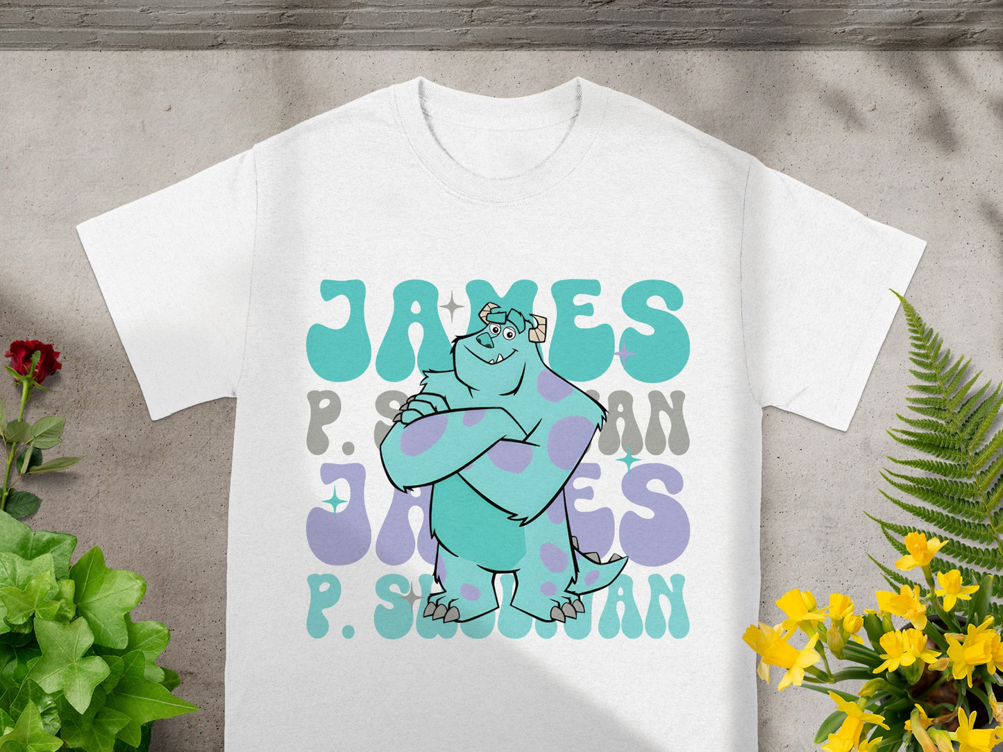 White t-shirt with Sulley from Monsters, Inc. and "James P. Sullivan" text.