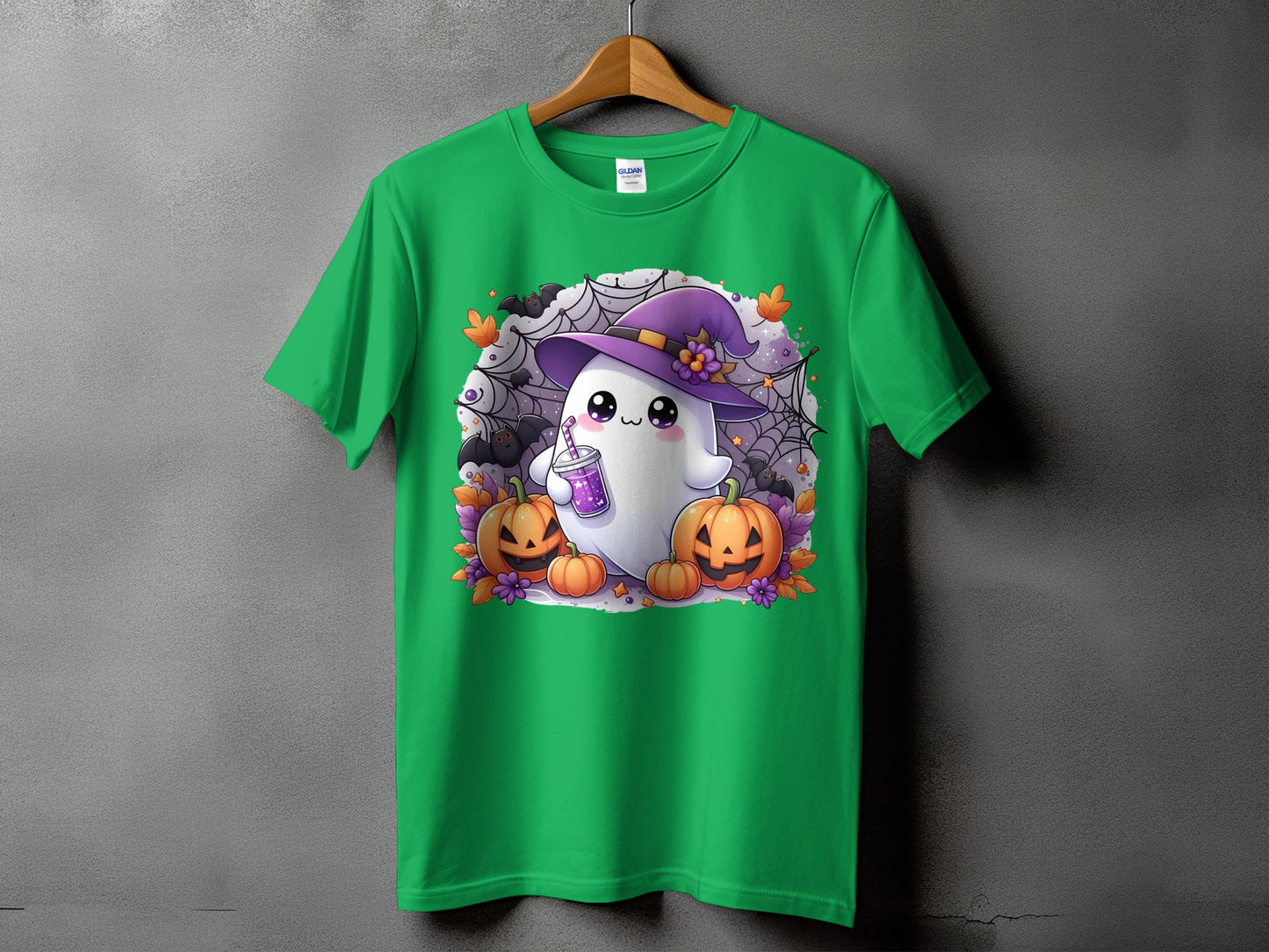 Green t-shirt with a cute ghost, pumpkins, bats, and spiderwebs design.