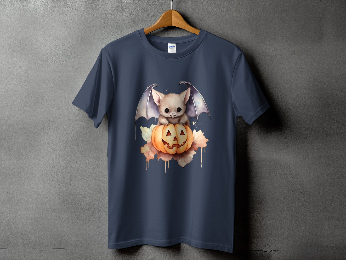 Cute bat with wings sits on a carved pumpkin with autumn leaves.