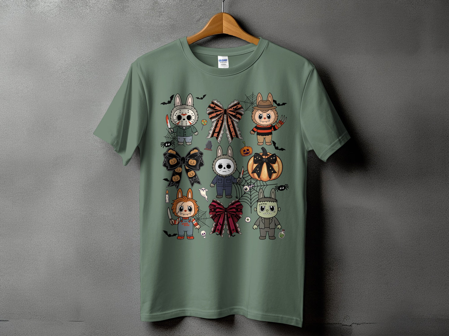 Green t-shirt with a Halloween-themed collage of cartoon characters and bows.