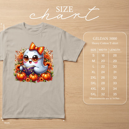 A light tan Gildan 5000 t-shirt with a cartoon ghost reading a book surrounded by pumpkins.