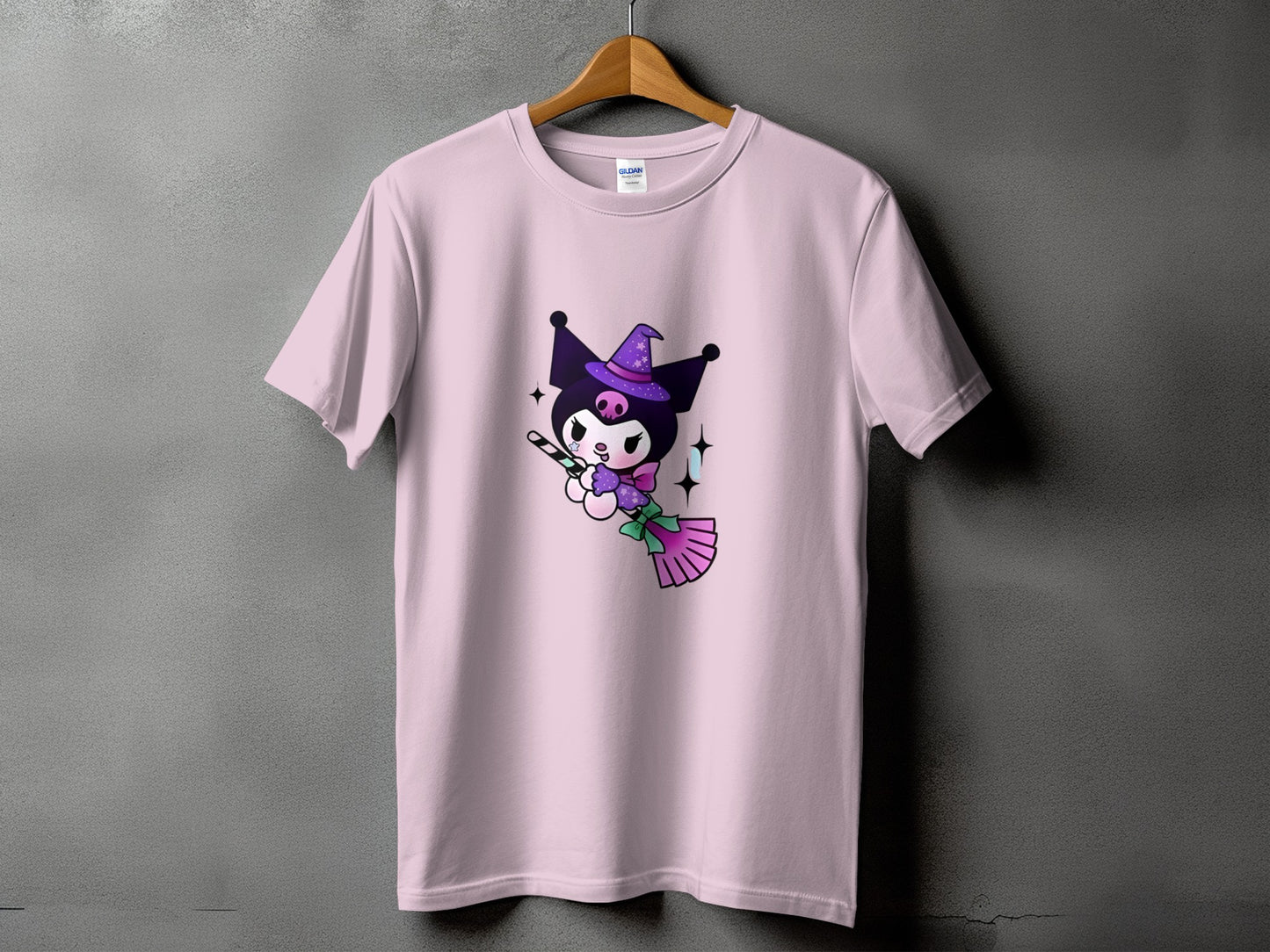 Pink t-shirt with Kuromi character wearing a witch hat holding a candy cane.