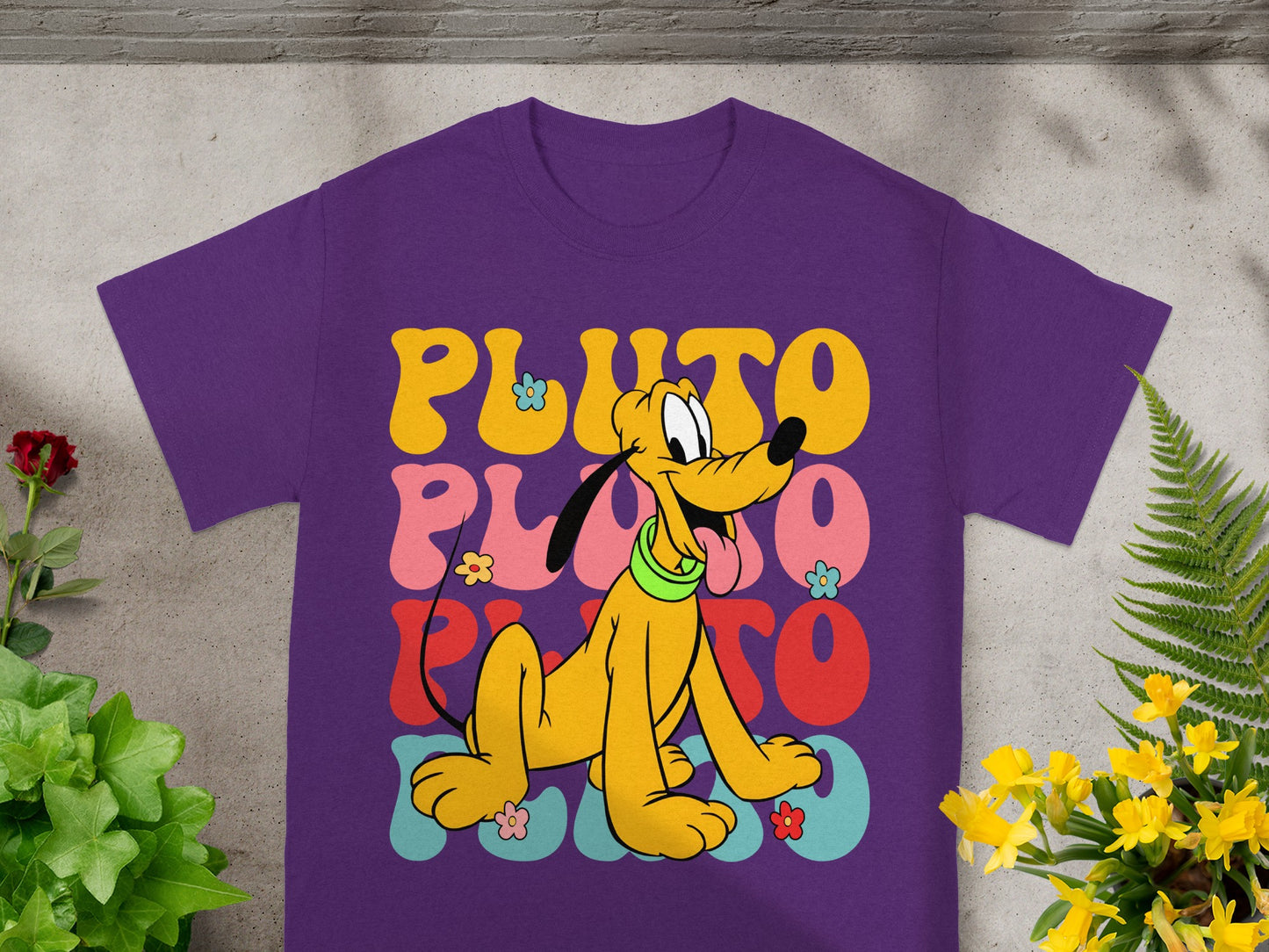 Purple t-shirt with Pluto design in colorful wavy text.