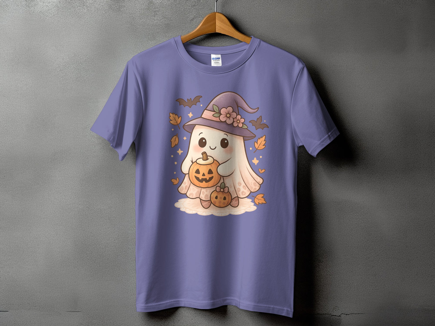 T-shirt with a cute ghost holding pumpkins and wearing a witch hat.