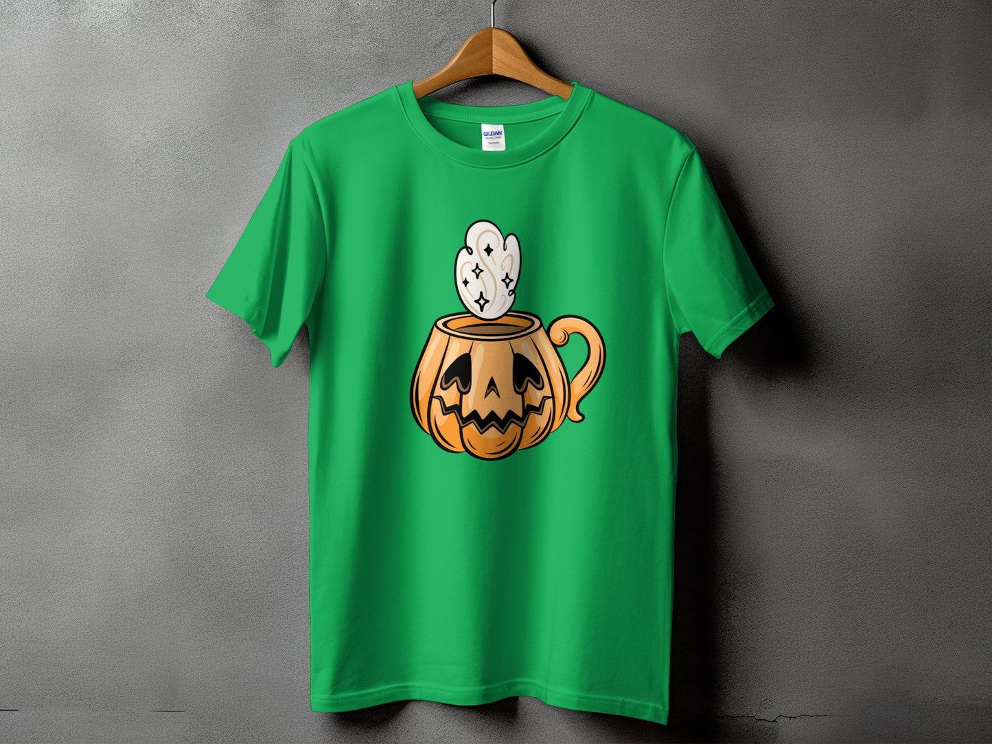 Green t-shirt with jack-o'-lantern mug and steam graphic.