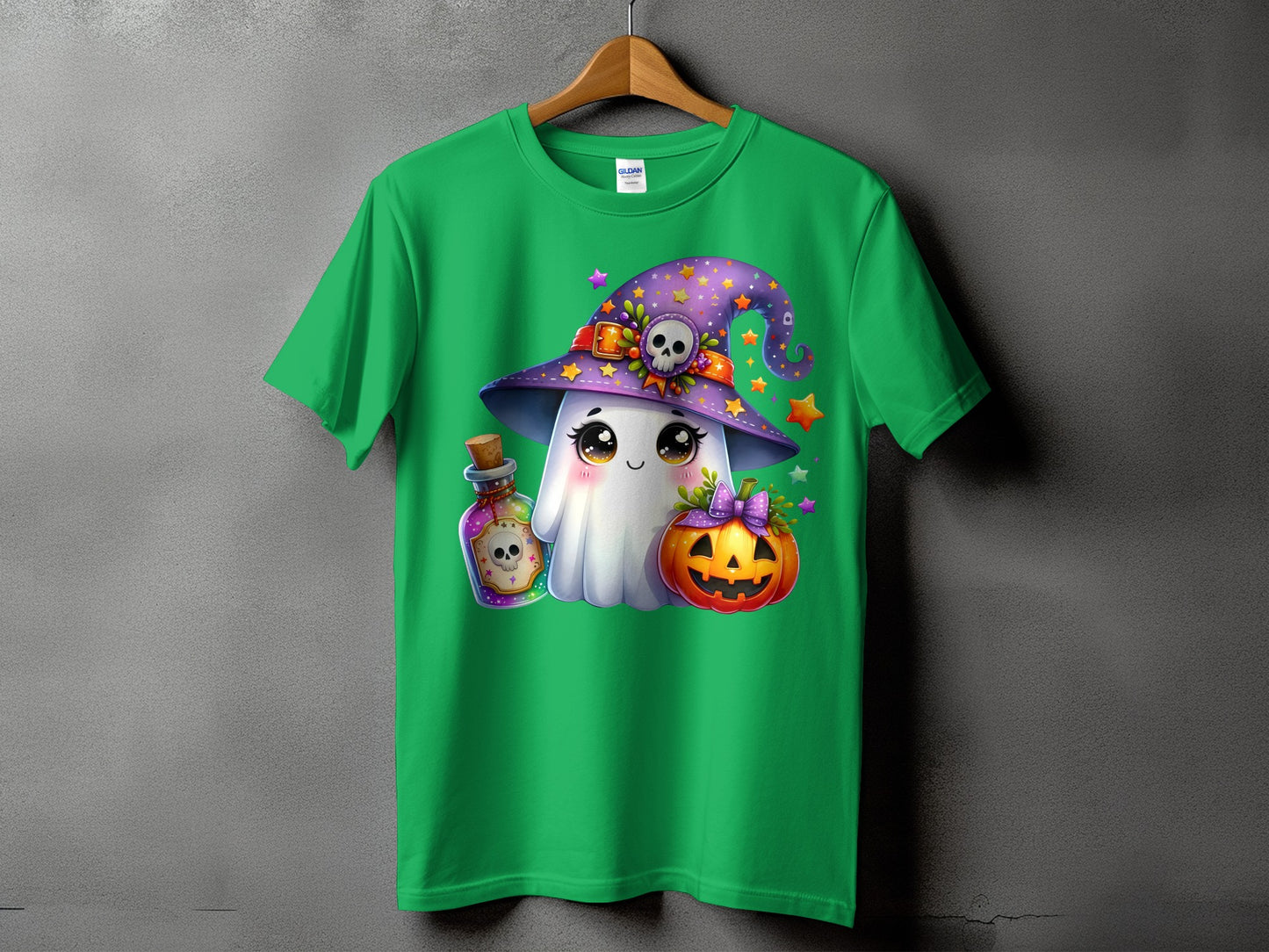 Green t-shirt with a cartoon ghost, witch hat, potion, and pumpkin design.