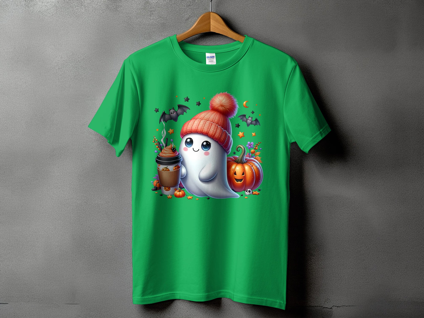 Green t-shirt with a cute ghost wearing a beanie, holding coffee, with pumpkins and bats.