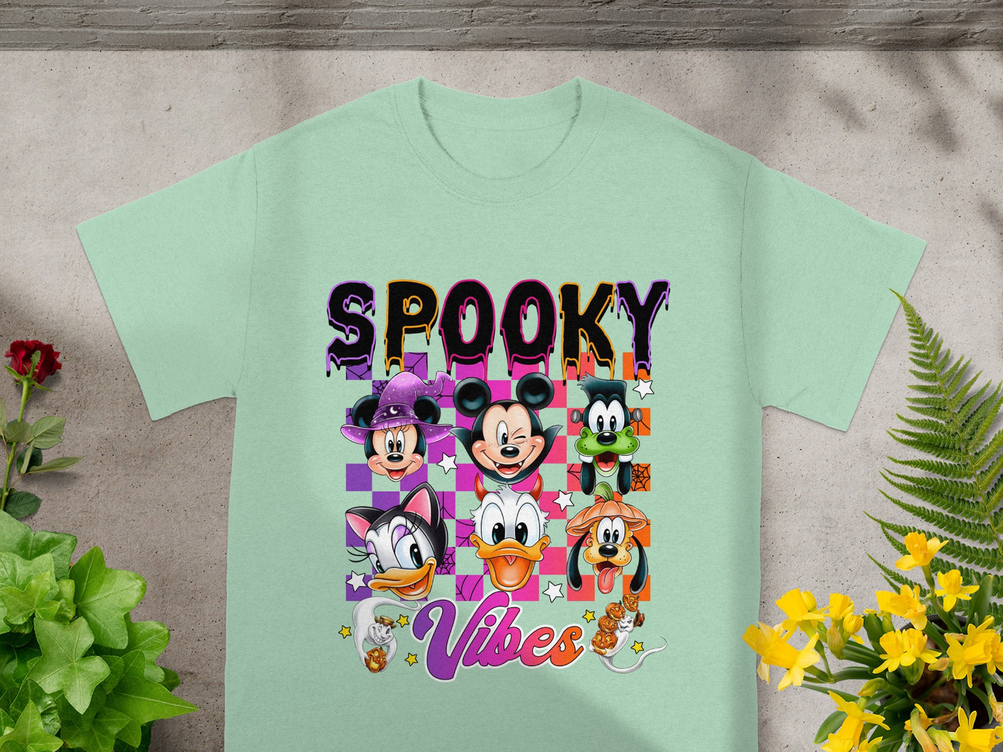 Minnie, Mickey, Goofy, Daisy, Donald, and Pluto characters with "Spooky Vibes" text.