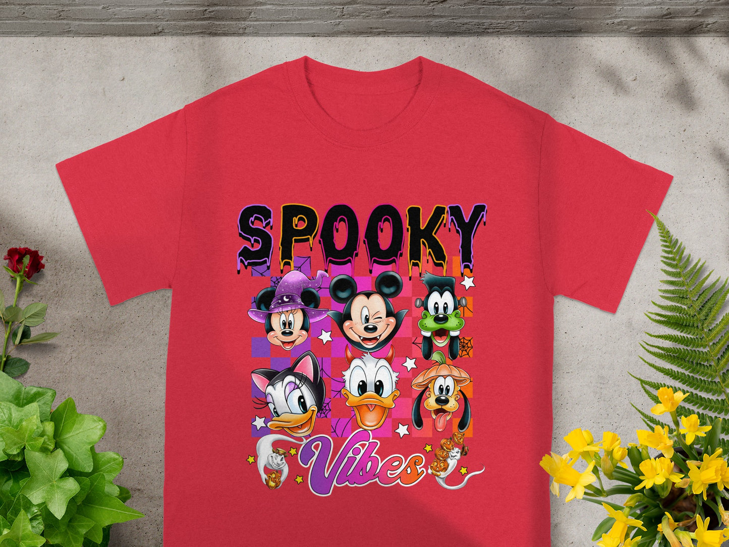 Red t-shirt with Disney characters and "Spooky Vibes" Halloween graphic.