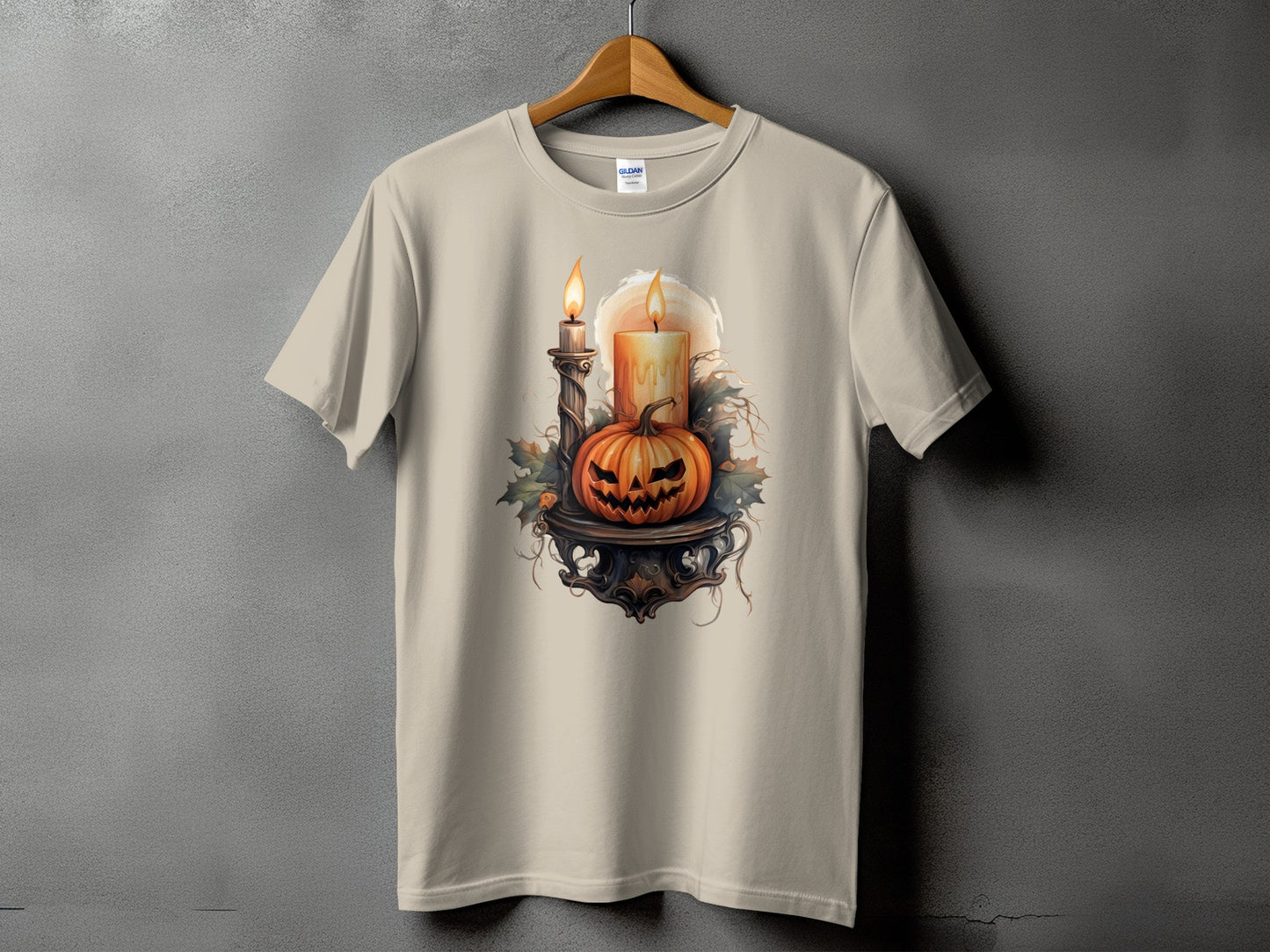 Light beige t-shirt with Halloween pumpkin, lit candles, and foliage graphic.