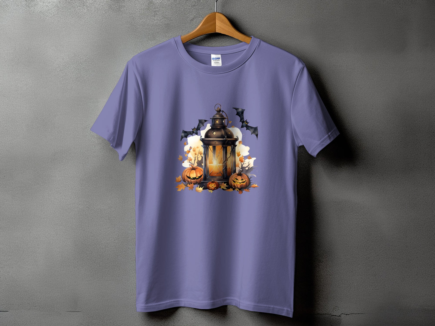 Purple t-shirt with Halloween graphic of lantern, pumpkins, and bats.